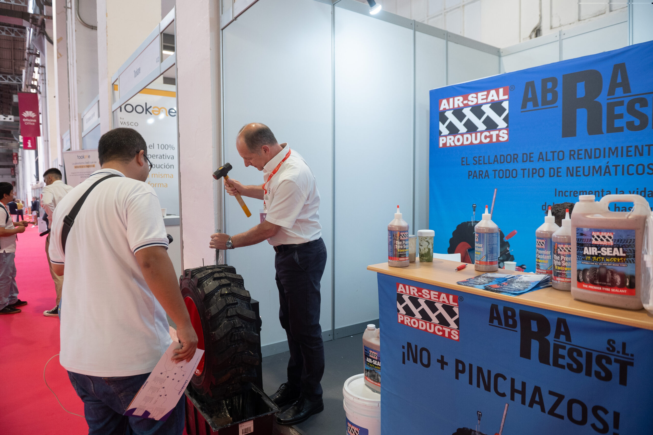 Steve in Barcelona on Trade Stand with hammer and a demo tyre