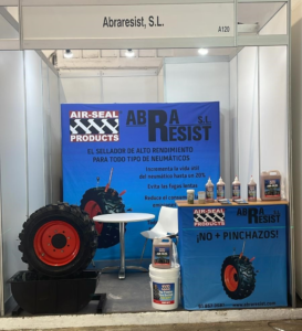 ASP trade stand in SIL Barcelona with blue background and demo tyre